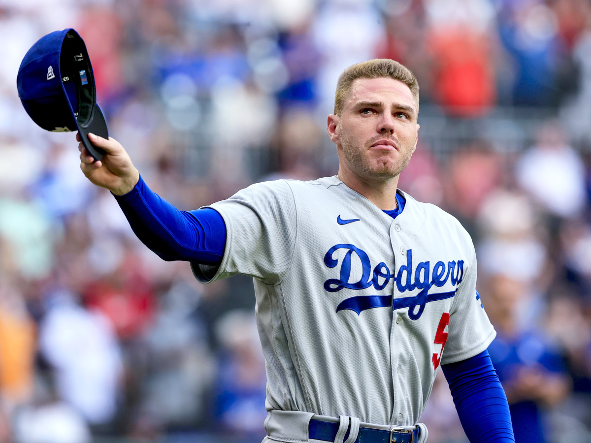Los Angeles Dodgers first baseman Freddie Freeman walks to the field for the presentation of his World Series championship ring, before the team’s baseball game against the Atlanta Braves on Friday, June 24, 2022 in Atlanta.